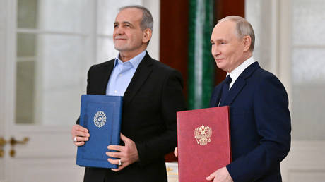 Russian President Vladimir Putin and Iranian President Masoud Pezeshkian attend a ceremony to sign an agreement of comprehensive strategic partnership between two countries at the Kremlin in Moscow, Russia.