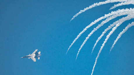 Indian Air force's Su-30 MKI performs at Marine Drive as several people witness the Mumbai Air Show 2024, on January 13, 2024 in Mumbai, India.