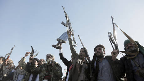 Yemen’s Houthis brandish weapons during a rally in Sanaa, Yemen on January 17, 2025.