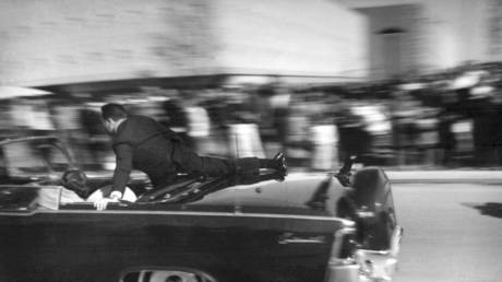 FILE PHOTO: The limousine carrying mortally wounded President John F. Kennedy races toward the hospital seconds after he was shot in Dallas, November 22, 1963