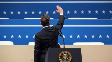 Billionaire Elon Musk raises his hand during an inauguration event on January 20, 2025 in Washington, DC.