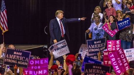 FILE PHOTO: US President Donald J. Trump gestures to crowd of supporters at the Phoenix Convention Center during a 2020 Trump rally.