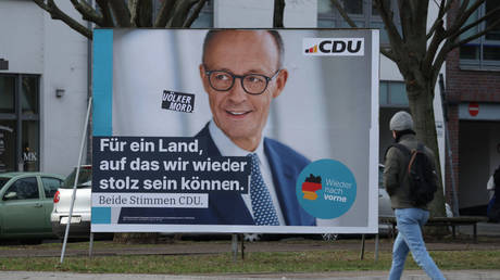 Friedrich Merz appears on an election billboard in Berlin, Germany, January 24, 2025