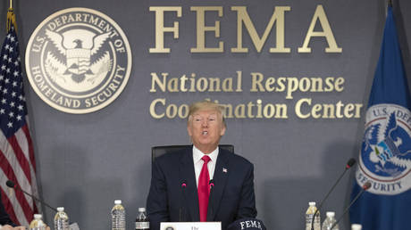 FILE PHOTO: US President Donald Trump speaks during a visit to Federal Emergency Management Agency (FEMA) headquarters.