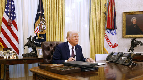 FILE PHOTO. US President Donald Trump signs a series of executive orders.