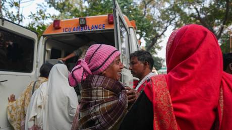 Relatives wait outside a hospital mortuary following a stampede amid the ongoing Maha Kumbh Mela Festival in Prayagraj, India on January 29, 2025.