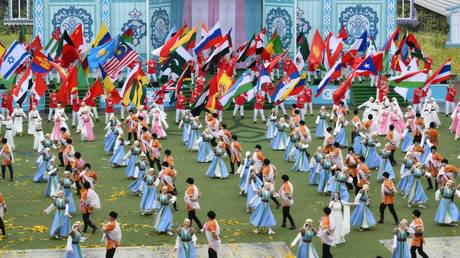 FILE PHOTO: Artists carrying national flags perform during the closing ceremony of the 2024 BRICS Sports Games in the village of Mirny, outside Kazan, Republic of Tatarstan, Russia.