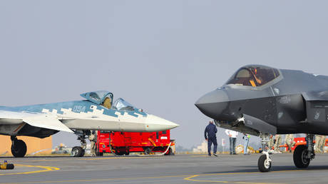 The Russian Sukhoi SU-57E stealth multirole fighter jet and the US Lockheed Martin F-35 Lightning II stealth strike fighter are on display during the 2025 Aero India air show at Yelahanka Air Force Station in Bengaluru, Karnataka, India.