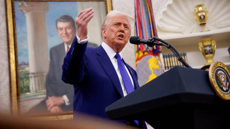 US President Donald Trump speaks in the Oval Office.