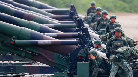 FILE PHOTO: Taiwanese soldiers prepare for training using the M110 American self-propelled howitzers, during a live-ammunition artillery training.