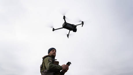 FILE PHOTO: A Ukrainian soldier is seen flying a drone.