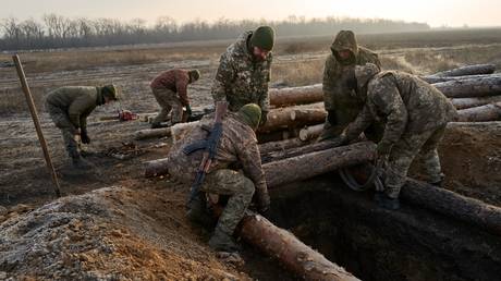 Ukrainian soldiers build defensive lines near the front line in Donbass, February 14, 2025.