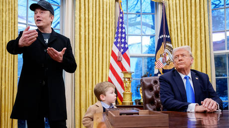 Tesla and SpaceX CEO Elon Musk, accompanied by U.S. President Donald Trump, and his son X Musk, speaks during an executive order signing in the Oval Office at the White House on February 11, 2025 in Washington, DC.