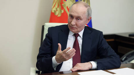 Russian President Vladimir Putin answers questions from journalist Pavel Zarubin during an interview at the Novo-Ogaryovo state residence outside Moscow, Russia.