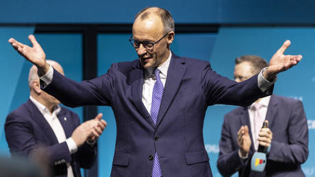 FILE PHOTO: Friedrich Merz, chancellor candidate of Germany's Christian Democrats (CDU/CSU), reacts after his speech during an election campaign tour stop.