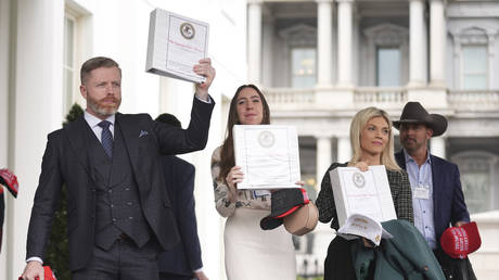 Conservative influencers leaving the White House with binders titled 'The Epstein Files: Phase 1', February 27, 2025