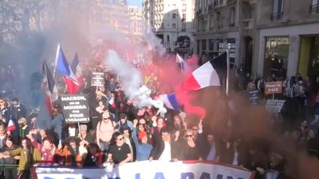 Thousands March in Paris to Oppose Macron's Defense Policies