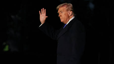 US President Donald Trump walks to the White House after landing in Marine One.