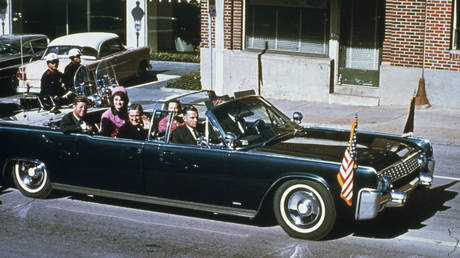 US President John F Kennedy, First Lady Jacqueline Kennedy and Texas Governor John Connally ride through the streets of Dallas, Texas prior to the assassination on November 22, 1963.