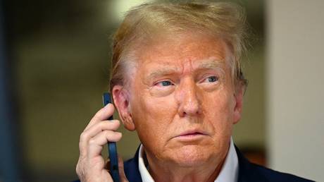 FILE PHOTO: Donald Trump talking on the phone.