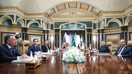 Russian Foreign Minister Sergey Lavrov (R) and Russian President Vladimir Putin's Foreign Policy Advisor Yuri Ushakov (2nd R) attend a meeting between Russia and the United States, in Riyadh, Saudi Arabia, on February 18, 2025.