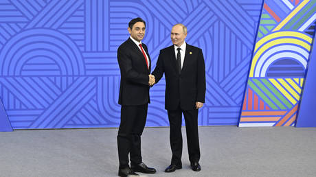 Russian President Vladimir Putin (R) greets Serbian Deputy Prime Minister Aleksandar Vulin at the BRICS Summit in Kazan, Russia, October 23, 2024.