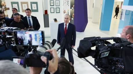 Russian President Vladimir Putin speaks to reporters at the Sirius Educational Center after a telephone conversation with US President Donald Trump.