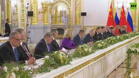 Putin and Xi Jinping hold talks in Moscow