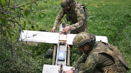 Russian servicemen of the Tsentr (Centre) group of forces prepare to launch a Molniya-2 strike-reconnaissance drone from a position in the Krasnoarmeysk sector of the frontline amid Russia's military operation in Ukraine.