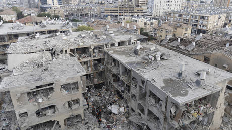 Rescue workers clear rubble after Iranian missile strikes on June 15, 2025, in Bat Yam, Israel.