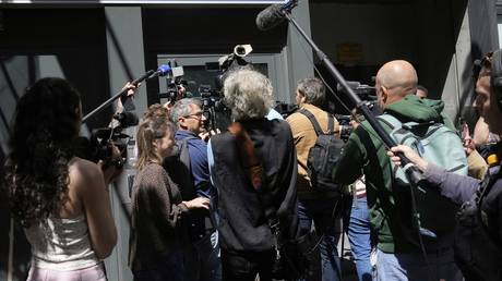 French investigators raid HQ of biggest opposition party