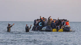 French police entering the sea with knives to tackle illegal migration