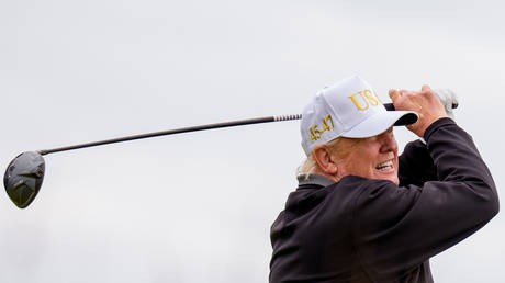U.S. President Donald Trump tees off at a new 18-hole course at Trump International Golf Links on July 29, 2025 in Balmedie, near Aberdeen, Scotland.