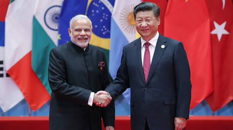 Chinese President Xi Jinping shakes hands with Indian Prime Minister Narendra Modi at the G20 Summit on September 4, 2016, in Hangzhou, China.