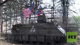 Russian troops from viral clip explain why they hoisted US flag (VIDEO)