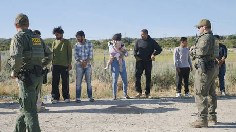 FILE PHOTO. Irregular migrants camping in the border area of Jacumba, California, United States attempt to cross the US border from Mexico as they are detained by US border patrol officers on June 04, 2024.