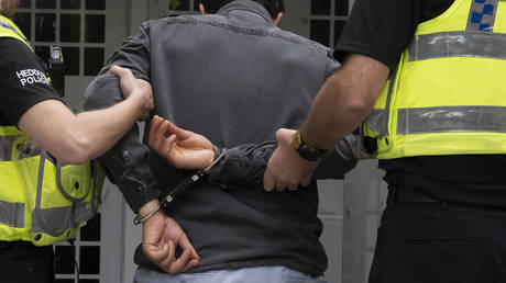Suspect in airport cyberattack held in UK