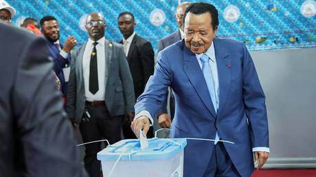 President Paul Biya casts his ballot at the Government Bilingual primary school Bastos in Yaounde, Cameroon, Oct. 12, 2025.