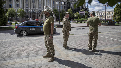 Ukrainian draft enforcers snatch teacher in front of students (VIDEO)