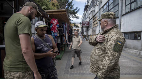 UKRAINE ERUPTS: Civilian Turns on Draft Squad in Shocking Rebellion! [VIDEO]