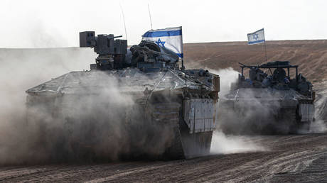 FILE PHOTO: The Israeli tanks with Israeli flags.