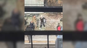 Ukrainian draft officer pepper-sprays woman holding child – media (VIDEO)