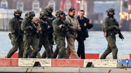 Venezuelan President Nicolas Maduro and his wife Cilia Flores arrive at the Wall Street Heliport in New York City, January 5, 2026.