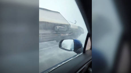 WATCH brutal blizzard flip truck over in Russia