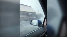 WATCH brutal blizzard flip truck over in Russia