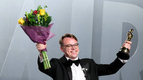 Pavel Talankin holds the Oscar he won for Best Documentary for the film Mr. Nobody Against Putin