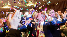 AfD members celebrate their regional election result in Mainz, Germany, on March 22, 2026.
