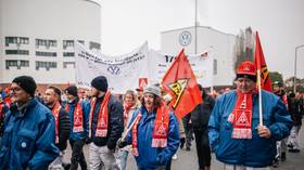 Workers protest during a warning strike outside the Volkswagen factory in Osnabrueck, Germany, November 6, 2024.
