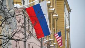 Russian and US flags are seen outside of the US embassy in Moscow, Russia, on January 15, 2026.