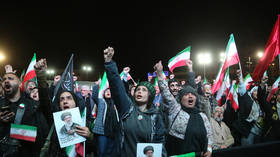 Iranians protest Israeli and US attacks on their country, carrying photos of the late Ali Khamenei.